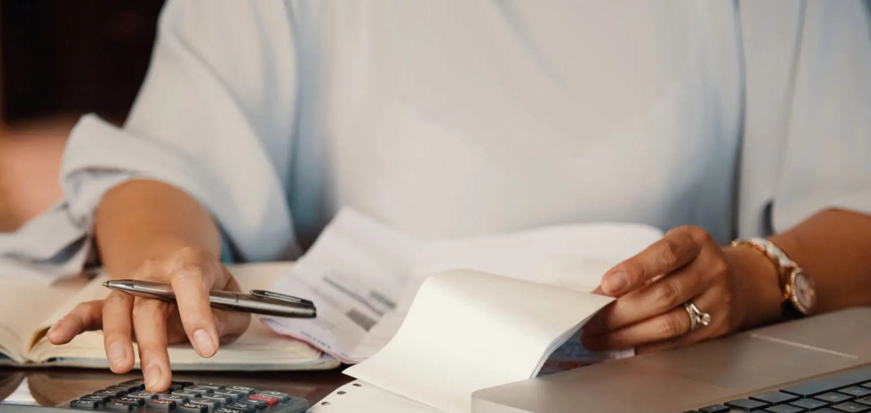 Small business owner reviewing invoices